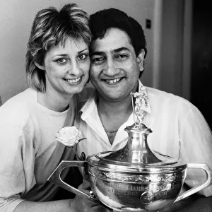 New snooker World Champion Joe Johnson holds on to the trophy with his wife Terryll