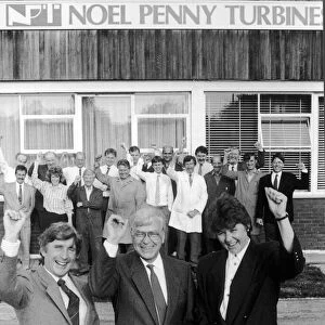 Noel Penny, owner and Chairman of Noel Penny Turbines celebrates as he signs a joint