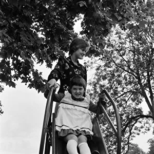 The Nolan sisters, Bernadette (13) and Coleen (9) in Hyde Park, London. 18th August 1974
