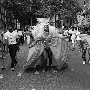 Notting Hill Carnival August 1984 Men, women and children dancing
