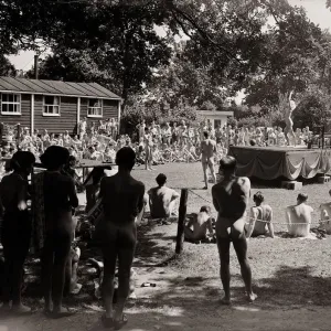 Nudist Beauty Contest - August 1957 people gather round a stage to view contestants