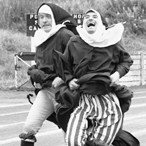 The Nuns Olympics. The 100 metre dash by two nuns in the form of left Kevin Moran