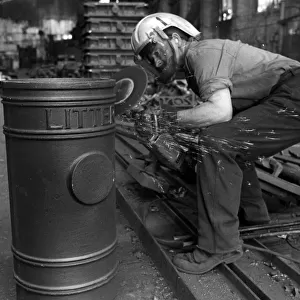 Parkfield Foundries in Stockton on Tees. Foundry worker Roy Moore with a litter bin for