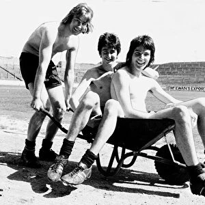 Partick Thistle football players Rough Houston and Hansen playing with wheelbarrow