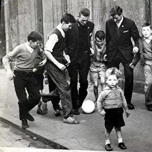 Pat Crerand with kids in the street 1960 pat Crerand on left football children