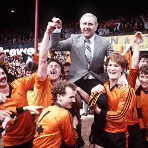 Paul Hegarty and Richard Gough give their manager a lift as they hold up Dundee United