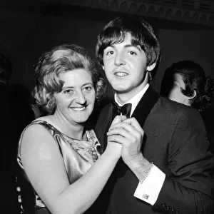 Paul McCartney and his Aunt Joan enjoy a dance at reception held at The Dorchester Hotel