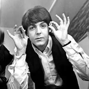 Paul McCartney with glass eyes when the Beatles details were being taken for their
