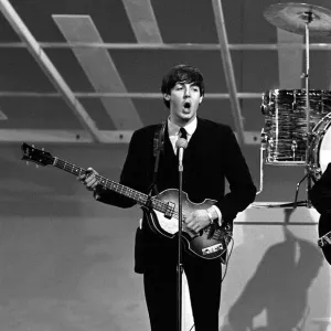 Paul McCartney playing guitar in New York during the Beatles first tour of America