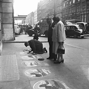 Pavement artist at work at Victoria Station, London, 21st May 1954