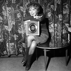 Petula Clark gets a golden disc for Downtown, her record which sold a million