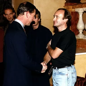 Phil Collins meeting Prince Charles after a one off concert at the royal abert hall