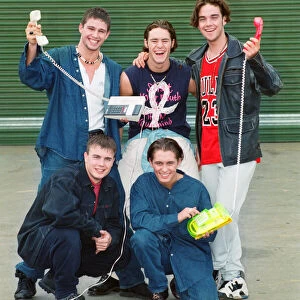 Photo shows boy band Take That, Howard Donald (top left), Jason Orange (top middle)