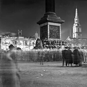 Picture shows night time crowds in Trafalgar Square, celebrating the Silver Jubilee of