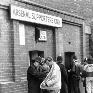 Police checking a fans jacket outside Highbury. 5th March 1990