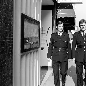 Policemen Ray Fullalove and Sgt. James Findlay on patrol. February 1975 75-01072