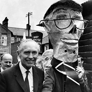 The Prime Minister, Alec Douglas-Home rejects the hand of somebody wearing a mask of