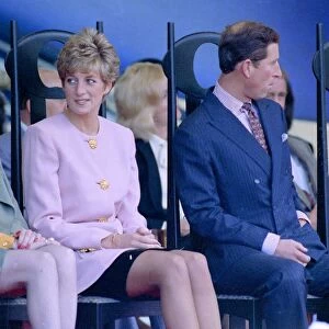 Prince Charles and Diana Princess of Wales look in separate directions at a reception in