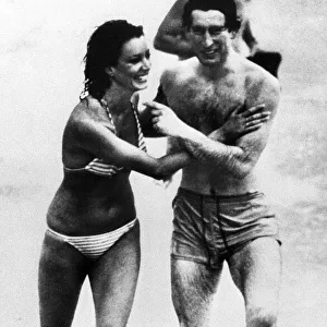 Prince Charles plays with model Jane Priest on Cottesloe Beach, Perth, Western Australia
