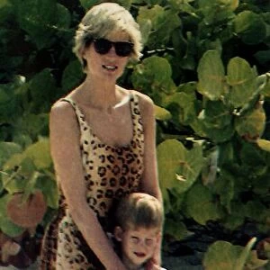 Princess Diana poses on the beach with her son Prince Harry on holiday in the Bahamas