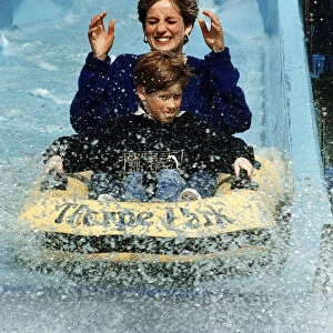 Princess Diana and Prince Harry laughing and getting soaked on water slide ride in Thorpe