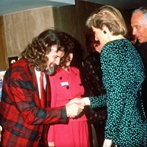 Princess Diana shakes hands with Scottish comedian Billy Connolly