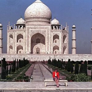 Princess Diana sits alone on a seat in front of the Taj Mahal in Agra, India