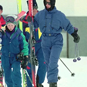 Princess Diana wearing ski-ing outfit and balaclava and sunglasses during a ski-ing