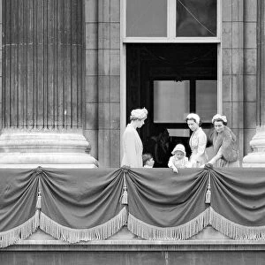Princess Margaret with Prince Charles and Princess Anne pointing over the balcony of