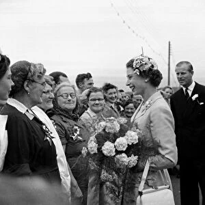 Queen Elizabeth chats with fisher Women at Peel Isle of man with Prince Philip Duke of