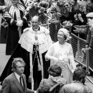 Queen Elizabeth II waving at the crowd during their Silver Jubilee celebrations