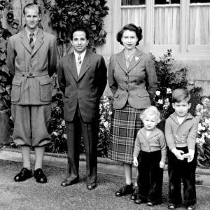 The Queen and Prince Philip with Prince Charles and Princess Anne pose with King Feisal
