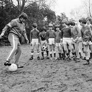 Queens Park Rangers footballer Don Masson coaching children to play football at the Our