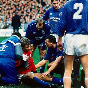 Rangers versus Celtic : Chris Woods receives treatment for injury January 1988