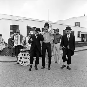 Recognise the bowler-hatted "busker"? Its Cliff Richard