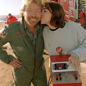 Richard Branson is kissed by one of the ground crew Virgin Global Challenger balloon