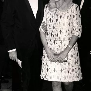 ROGER MOORE AND LISA MOORE AT THE PREMIERE OF CUSTER OF THE WEST