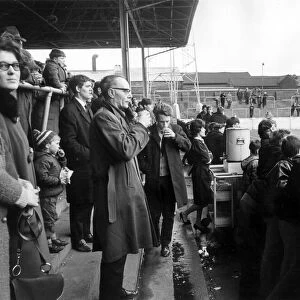 Rotherham Football Club. Supporters buying tea from an Urn in the stands