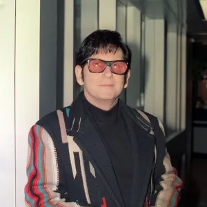 Roy Orbison at Heathrow Airport November 1988 in multi coloured coat