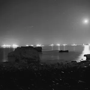 Royal Navy fleet anchored in Torbay and floodlit in July 1969