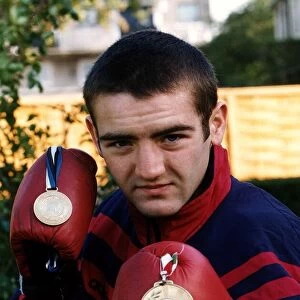 Scott Harrison Scottish European boxing Champion holding two medals