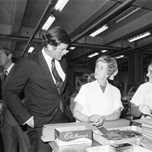 Senator Edward Kennedy seen here chatting to two of the Cadbury work force during his