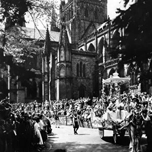 In the shadow of Lichfield Cathedral, the Greenhill Bower procession makes its way