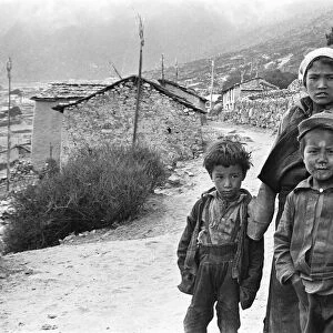 Sherpa children pose in the street of one of the high villages in the SoluKhumbu region