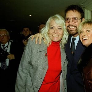 Singer Cliff Richard poses Eastenders actress Wendy Richard (left