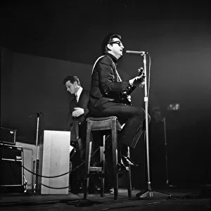Singer and musician Roy Orbison performing on stage at the De Montfort Hall in April