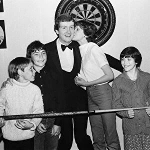 Snooker player Steve Davis gets a kiss from an admiring fan. 8th June 1981