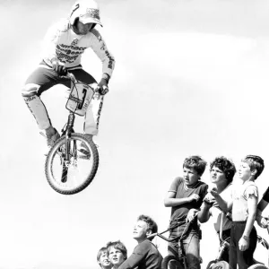 Startled BMX children watch as Pete Middleton demonstrates his skill