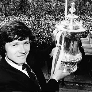 Steve Perryman with the FA cup and thousands of Tottenhan Hotspur fans behind him