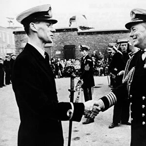 Sub-Lieutenant David Bingham (l) receives the sword of honour in 1970 two years before